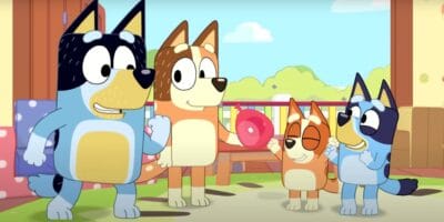 Bandit excited with Chilli, Bingo, and Bluey in Bluey: The Videogame