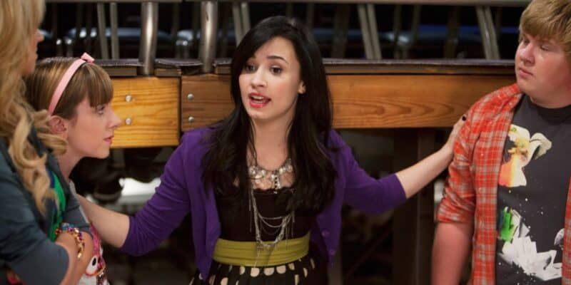Demi Lovato wearing a purple sweater in the Dinsey Channel Original Series Sonny With a Chance