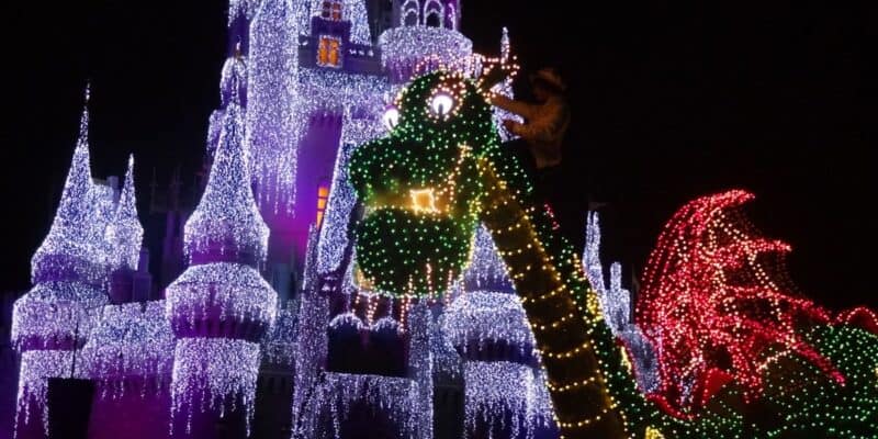 'Pete's Dragon' float lights up in front of Cinderella Castle in the Main Street Electrical Parade at Disney World