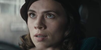 Hayley Atwell looking out the window shocked in Christopher Robin
