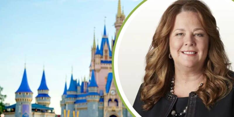 Former Chief Information Officer Diane Jurgens with the Cinderella castle at Magic Kingdom in the background.