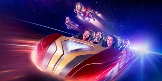 Guests ride Avengers Assemble: Flight Force while Captain Marvel and Iron Man fly alongside them