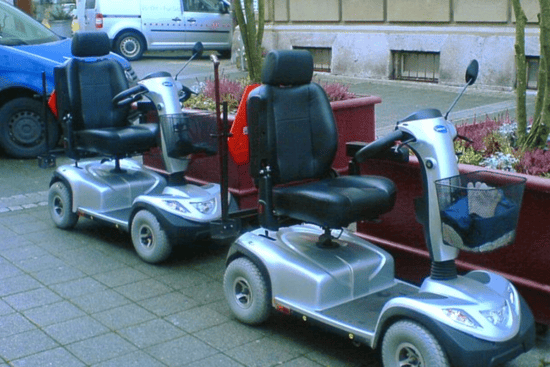Two gray mobility scooters like the ones used at Walt Disney World