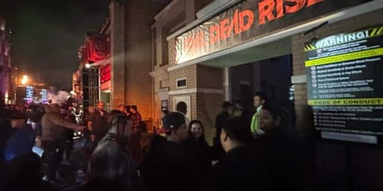 Guests waiting around the entrance to the Evil Dead Rise house after it was shut down