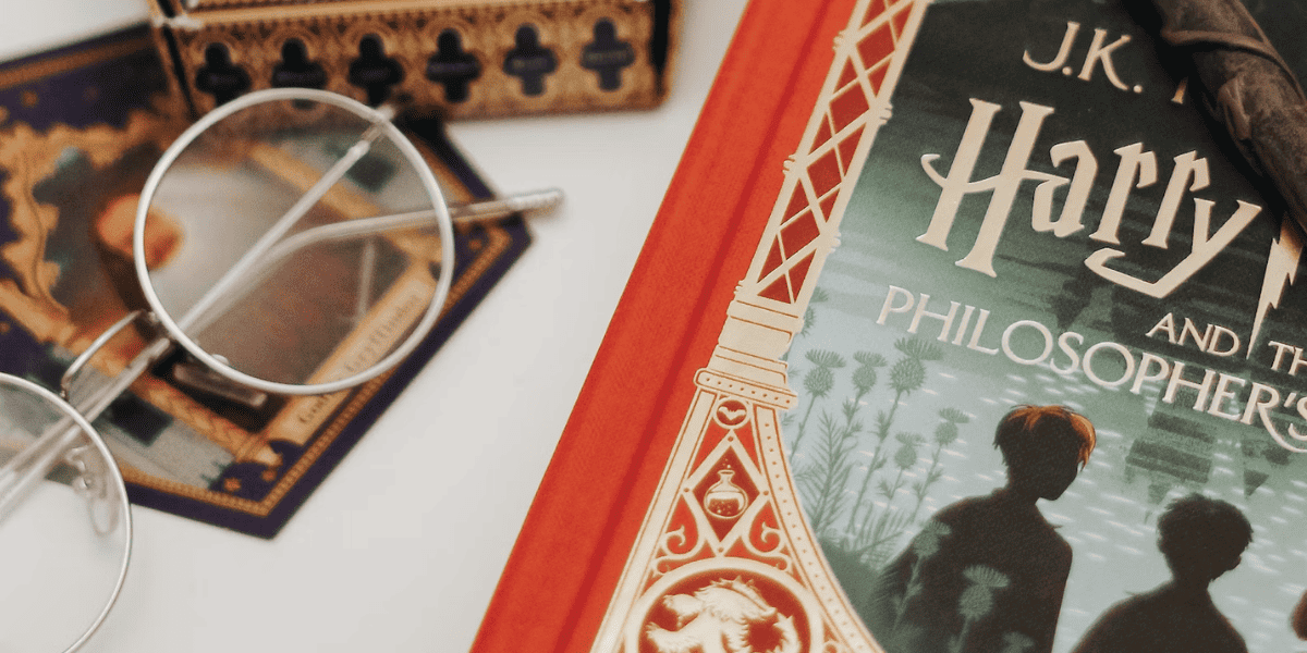 Harry Potter book placed next to round glasses