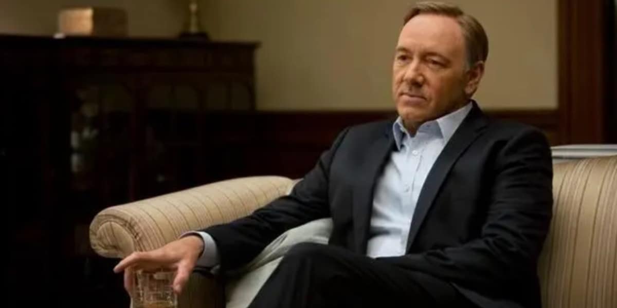 Kevin Spacey sitting on a couch in House of Cards
