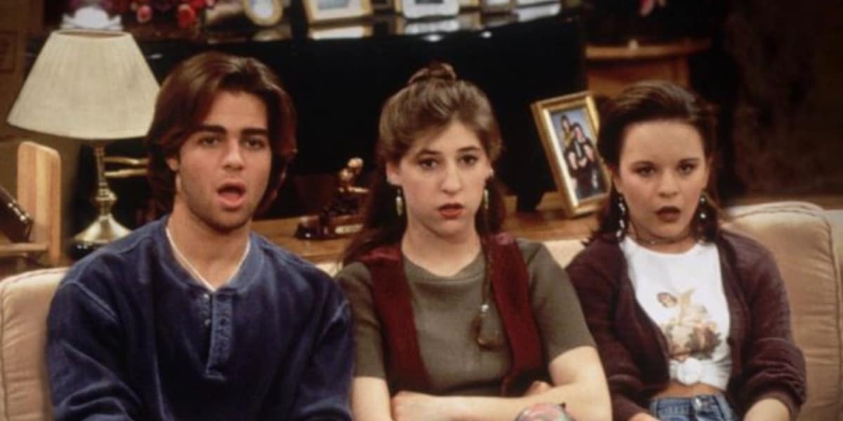 The cast of Blossom looking shocked on a couch