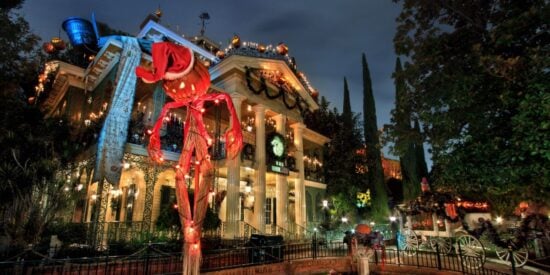 Haunted Mansion Holiday at Disneyland, featuring a pumpkin scarecrow dressed as santa claus