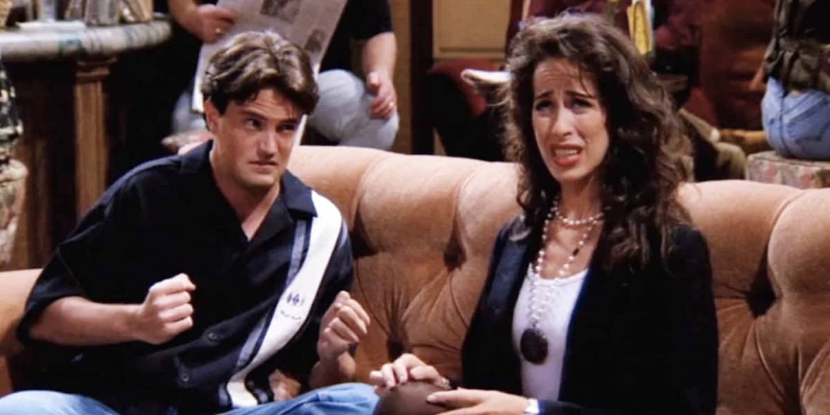 Chandler Bing (Matthew Perry) frustrated with Janice on a couch at Central Perk on Friends
