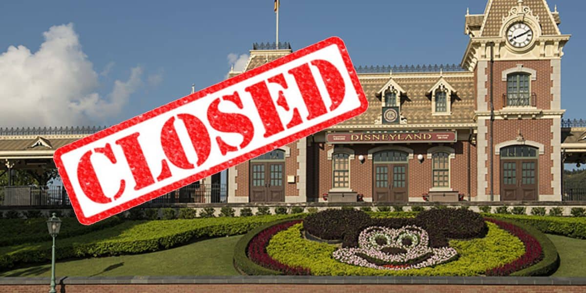 Hong Kong Disneyland entrance with a 'closed' sign over it