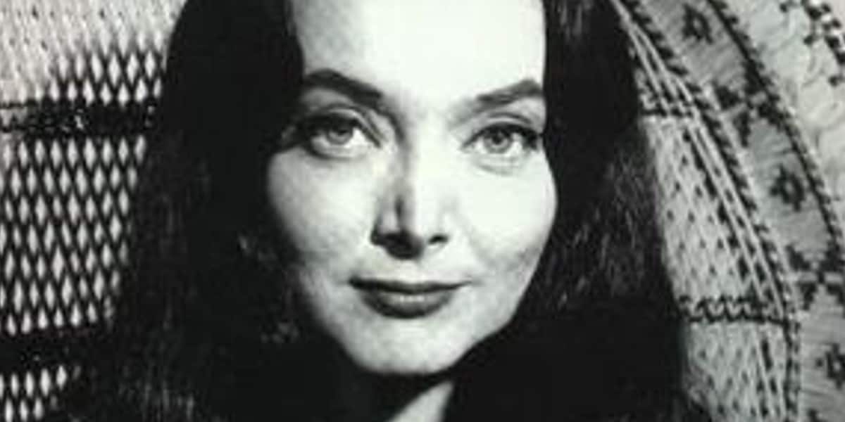 Morticia Addams (Carolyn Jones) smiling serenely