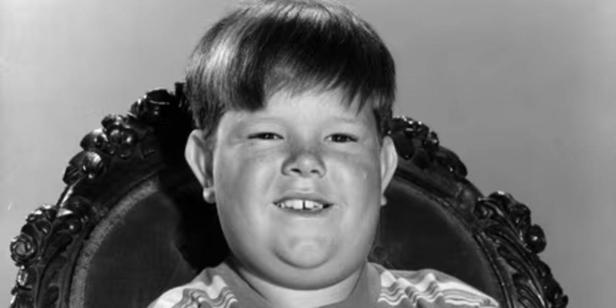 Pugsley Addams (Ken Weatherwax) smiling in The Addams Family sitcom