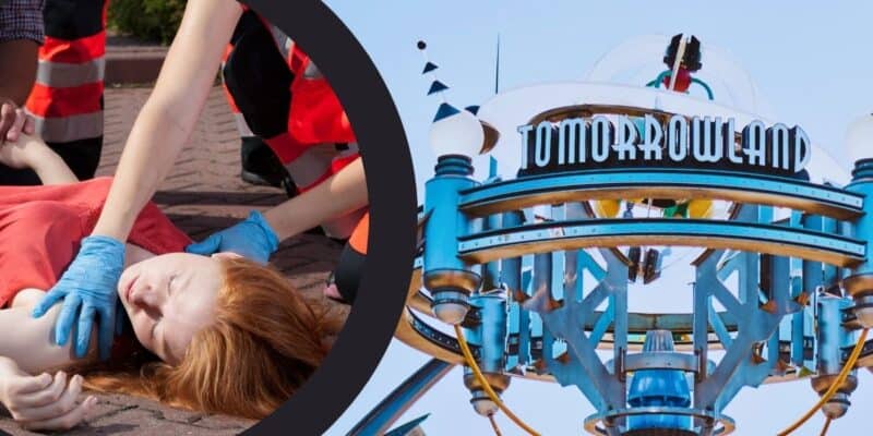 A little girl receiving CPR by paramedics with the Tomorrowland entrance sign to the right.