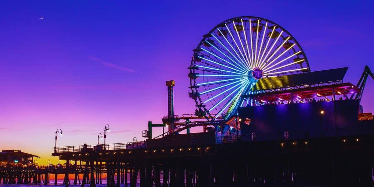 A wide shot nighttime photo of Pacific Park on the Santa Monica Pier in California.
