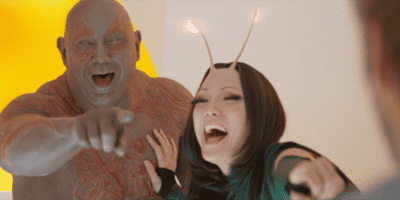 Drax and Mantis from 'Guardians of the Galaxy' laughing at the camera, making fun of Star-Lord