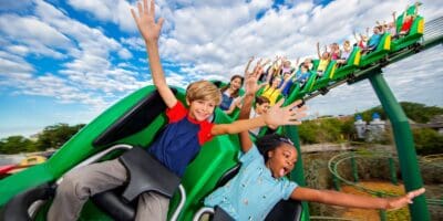Kids ride a roller coater at LEGOLAND California