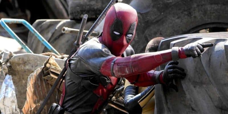 Ryan Reynolds as Deadpool scaling a wall in 'Deadpool'