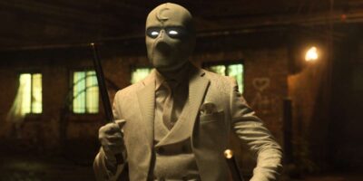 Oscar Isaac poses in a white suit as Marc Spector/Steven Grant in Marvel's 'Moon Knight'