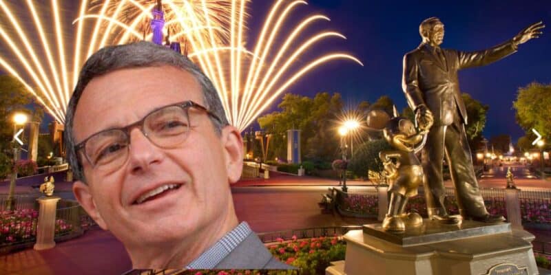 A smiling Bob Iger surrounded by fireworks at Walt Disney World