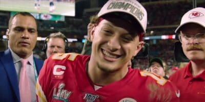 NFL Quarterback Patrick Mahomes smiling after winning the 2023 Super Bowl and saying, "I'm going to Disney World!"