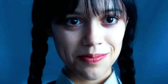Jenna Ortega smiling eerily as Wednesday Addams