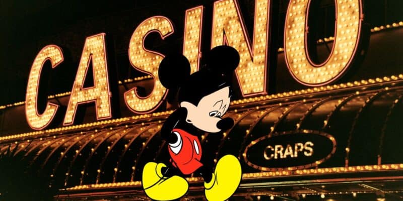 Mickey Mouse sadly walking from a casino sign