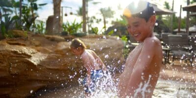 Kids splashing and playing in the pool at Disney Aulani