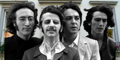 The Beatles posed in front of the studio entrance