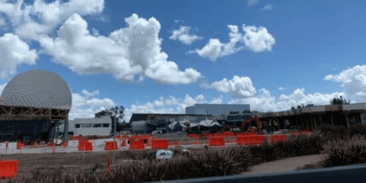 A sneak peek over the construction walls at EPCOT in front of Spaceship Earth.