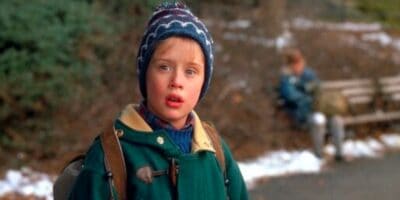 Macaulay Culkin as Kevin McAllister wearing a coat and beanie in 'Home Alone 2: Lost in New York'