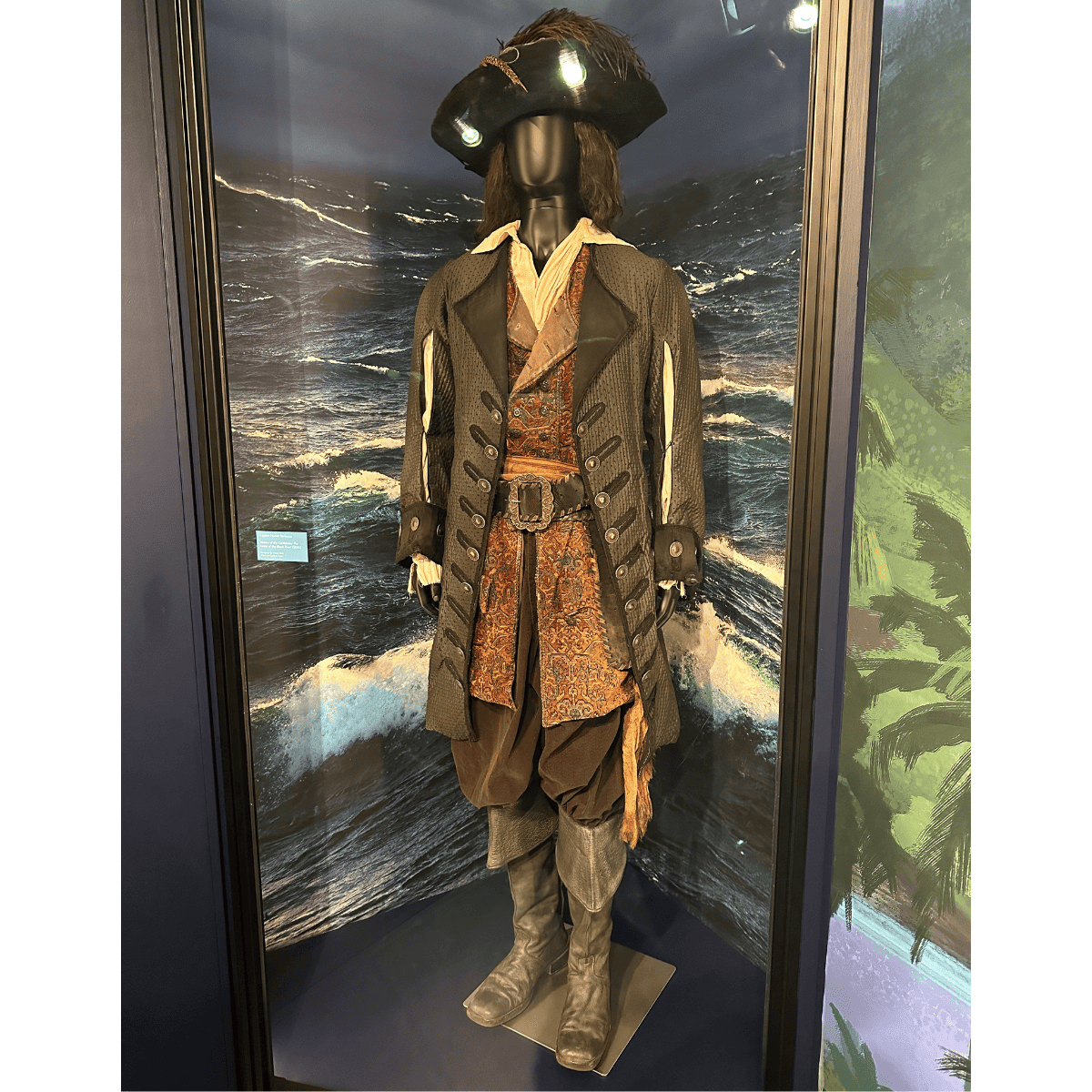 A costume worn by Geoffrey Rush as Hector Barbossa on display.
