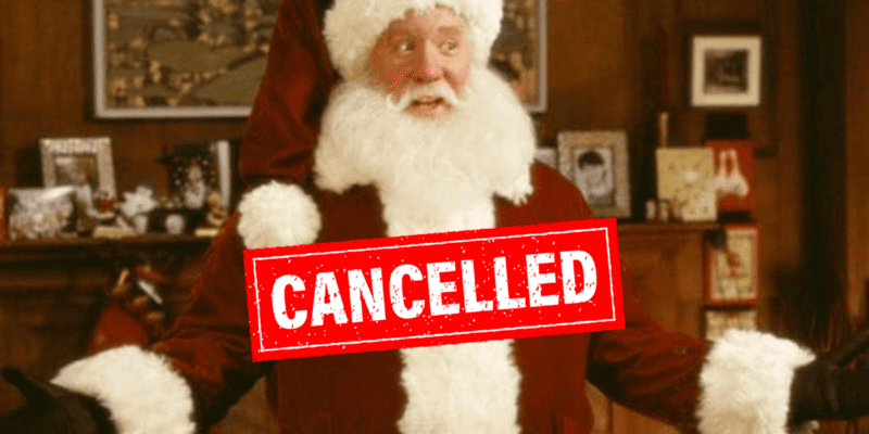 Tim Allen poses as Santa Claus with a bright red stamp reading "CANCELLED" in the foreground.