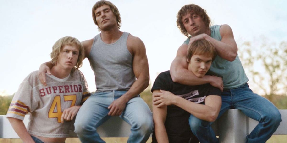 The Von Erich Brothers sitting on a fence in Iron Claw