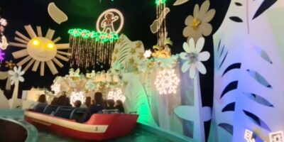 guests attempting to sink boat of "it's a small world" in Disneyland.