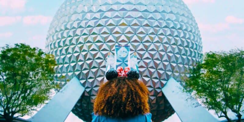 A little girl looking up at Spaceship Earth inside of EPCOT at Walt Disney World Resort.