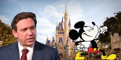Disney World with Mickey Mouse walking away from Ron DeSantis