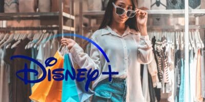 A woman holding shopping bags with the Disney+ logo