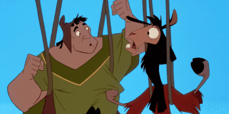 Kuzco and Pacha looking surprised while hanging from vines in 'The Emperor's New Groove' (2000), representing surprise after hearing that the musical inspired by the movie is not being developed by Disney