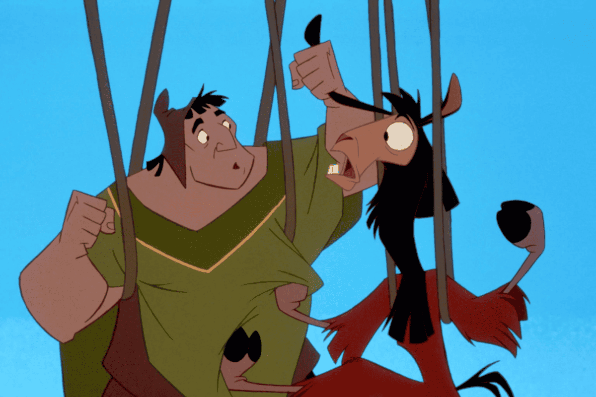Kuzco and Pacha looking surprised while hanging from vines in 'The Emperor's New Groove' (2000), representing surprise after hearing that the musical inspired by the movie is not being developed by Disney