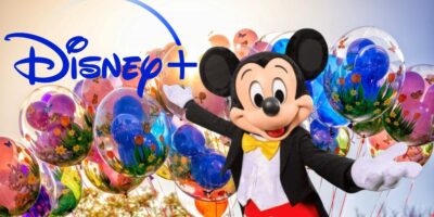 Mickey Mouse gesturing at Disney+ logo with balloons