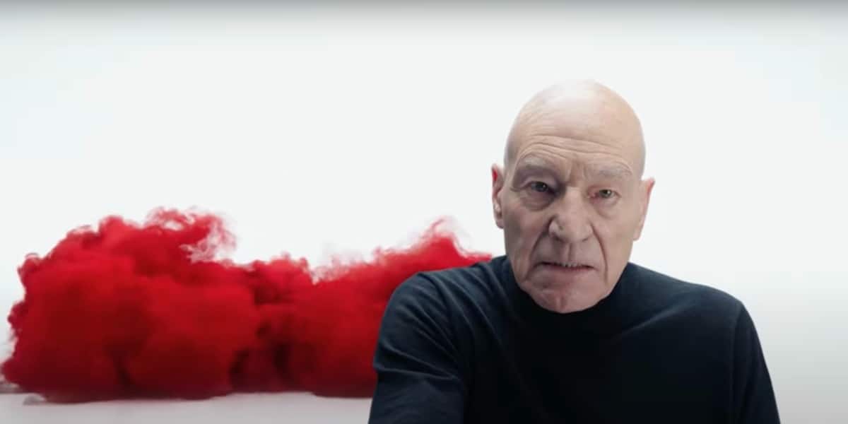 Charles Xavier/Professor X wearing a black turtleneck in a white void with a red cloud moving toward him
