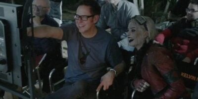 James Gunn and Margot Robbie looking at a monitor behind the scenes of The Suicide Squad