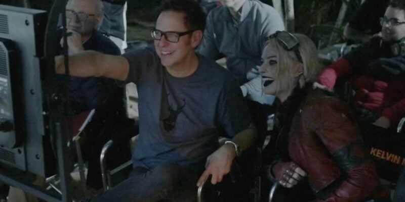 James Gunn and Margot Robbie looking at a monitor behind the scenes of The Suicide Squad