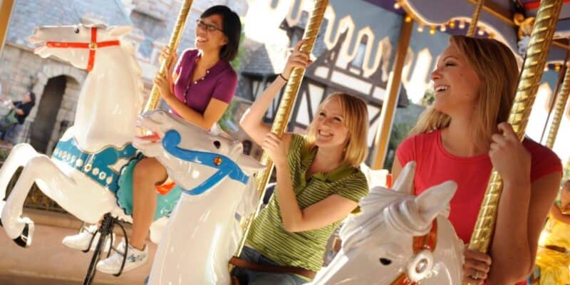 Guests riding King Arthur's Carrousel in Fantasyland