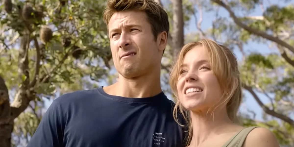 Glen Powell and Sydney Sweeney looking awkwardly into the distance in Anyone But You