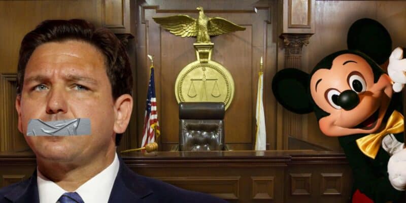 Ron DeSantis with duct tape over his mouth with Mickey Mouse peeking out of the corner inside a court room.