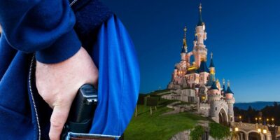 A guest revealing his concealed firearm inside of Disneyland Park in Paris.