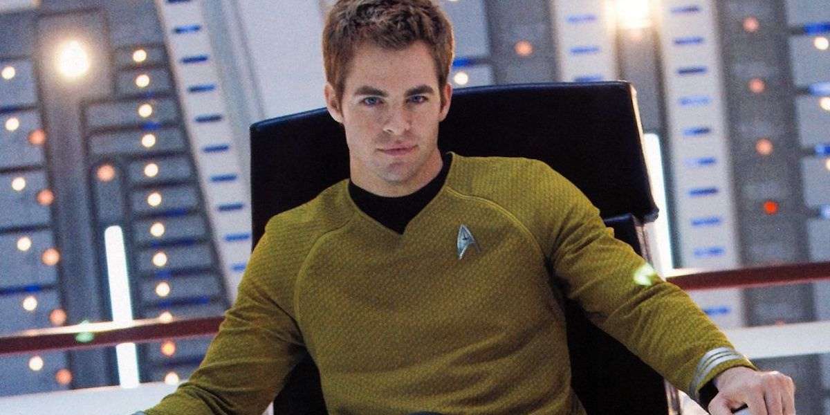 Chris Pine as Captain James T. Kirk sitting in the captain's chair in 'Star Trek'