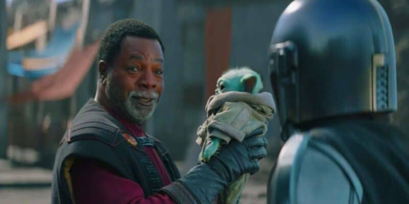 Greef Karga (Carl Weathers) holds Grogu