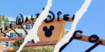 The Walt Disney Company building logo split into three separate images with tears through the front gates.